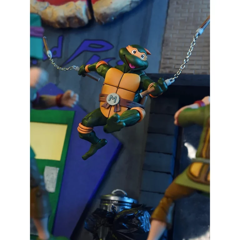 03. NECA Teenage Mutant Ninja Turtles Michelangelo (Cartoon) Figura, 18cm